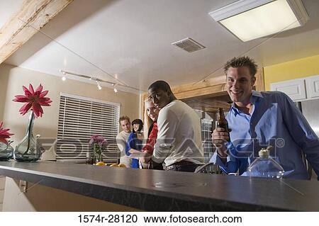 Portrait of men embracing women in domestic kitchen View Large Photo Image Stock Image - Portrait of men embracing women in domestic kitchen. Fotosearch