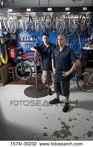 Portrait of men smiling in a workshop View Large Photo Image Stock Image - Portrait of men smiling in a workshop. Fotosearch