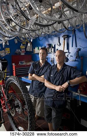 Portrait of men smiling in a workshop View Large Photo Image Stock Photo - Portrait of men smiling in a workshop. Fotosearch