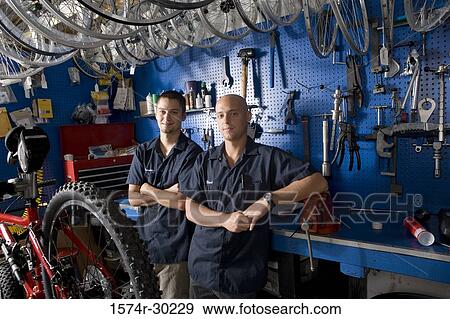 Portrait of men smiling in a workshop View Large Photo Image Stock Photo - Portrait of men smiling in a workshop. Fotosearch