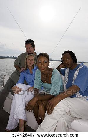 Portrait of mid adult couple sitting together in the boat View Large Photo Image Stock Photo - Portrait of mid adult couple sitting together in the boat. Fotosearch