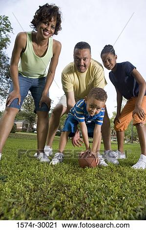 Portrait of parents playing with their children at park View Large Photo Image Stock Image - Portrait of parents playing with their children at park. Fotosearch