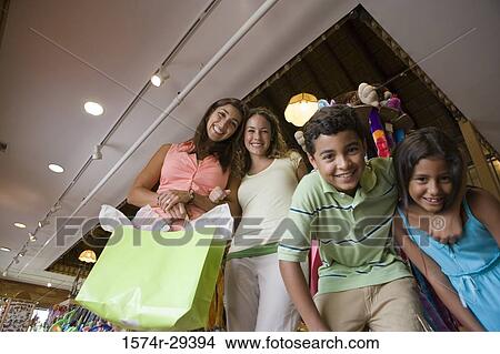 Portrait of people standing together in store View Large Photo Image Picture - Portrait of people standing together in store. Fotosearch