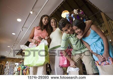 Stock Image - Portrait of people standing together in store. Fotosearch