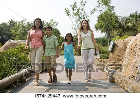 Portrait of people walking together on board walk View Large Photo Image Stock Photo - Portrait of people walking together on board walk. Fotosearch