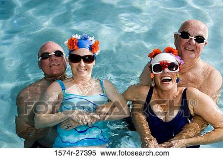 Portrait of senior couples swimming in swimming pool View Large Photo Image Stock Photography - Portrait of senior couples swimming in swimming pool. Fotosearch