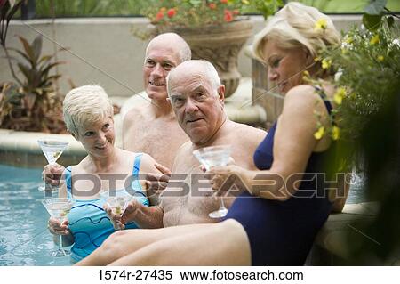 Portrait of senior man enjoying with friends at swimming pool View Large Photo Image Stock Photography - Portrait of senior man enjoying with friends at swimming pool. Fotosearch