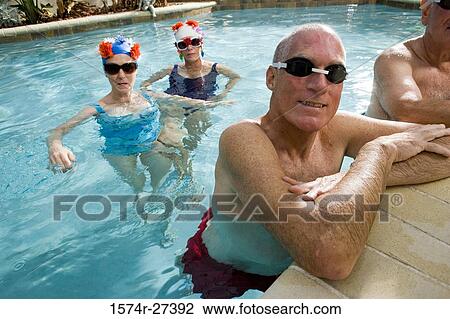 Portrait of senior men and senior women in swimming pool View Large Photo Image Stock Image - Portrait of senior men and senior women in swimming pool. Fotosearch