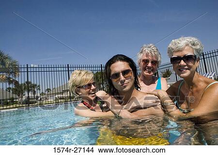 Portrait of senior women and young man having fun in swimming pool View Large Photo Image Picture - Portrait of senior women and young man having fun in swimming pool. Fotosearch