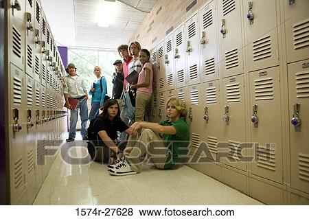Portrait of students by lockers in corridor View Large Photo Image Stock Photo - Portrait of students by lockers in corridor. Fotosearch