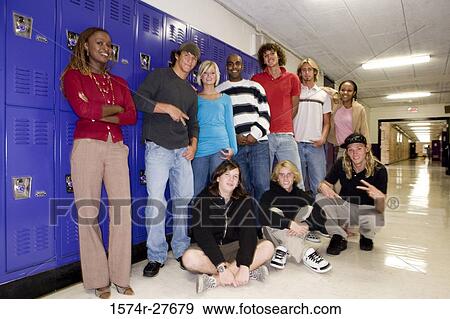 Portrait of students with female teacher smiling and standing by lockers View Large Photo Image Stock Photo - Portrait of students with female teacher smiling and standing by lockers. Fotosearch