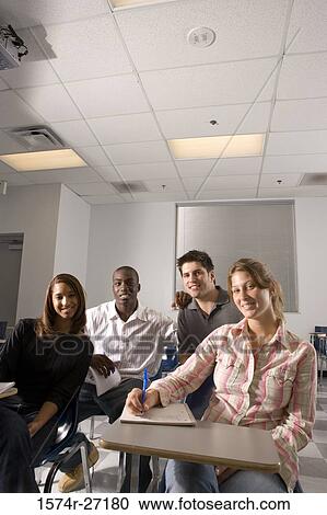 Portrait of university students smiling in the classroom View Large Photo Image Stock Image - Portrait of university students smiling in the classroom. Fotosearch