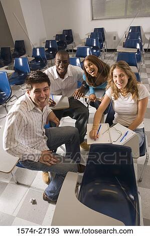 Portrait of university students smiling in the classroom View Large Photo Image Stock Image - Portrait of university students smiling in the classroom. Fotosearch