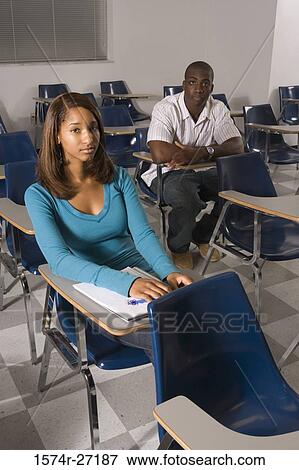 Portrait of university students attending lecture in the classroom View Large Photo Image Stock Photo - Portrait of university students attending lecture in the classroom. Fotosearch