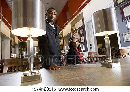 Stock Photography - Portrait of well-dressed businesspeople in an office. Fotosearch