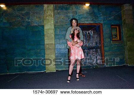 Portrait of young man standing with her sister View Large Photo Image Stock Photo - Portrait of young man standing with her sister. Fotosearch