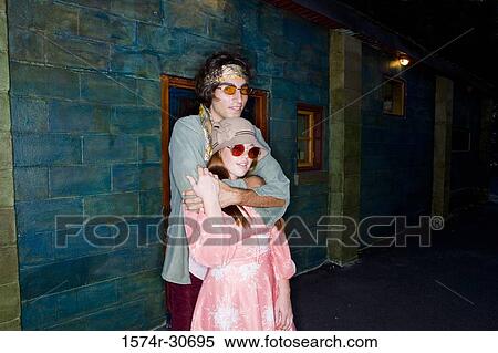 Portrait of young man standing with her sister View Large Photo Image Stock Photography - Portrait of young man standing with her sister. Fotosearch