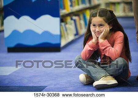 Schoolgirl sitting on floor with head in hands View Large Photo Image Stock Photo - Schoolgirl sitting on floor with head in hands. Fotosearch