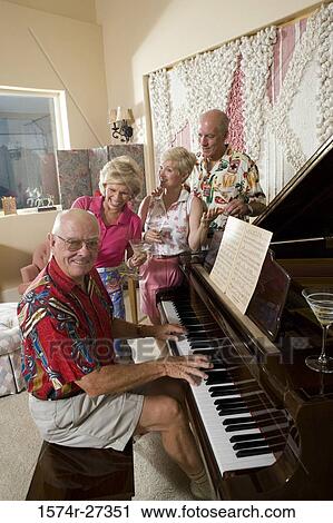 Senior people watching man play piano View Large Photo Image Stock Image - Senior people watching man play piano. Fotosearch