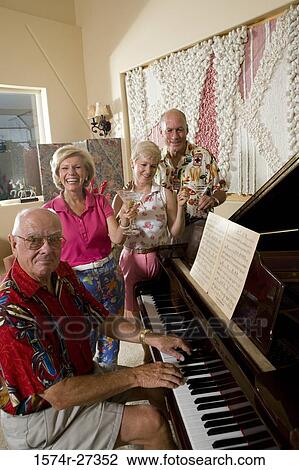 Senior people watching man play piano View Large Photo Image Stock Image - Senior people watching man play piano. Fotosearch