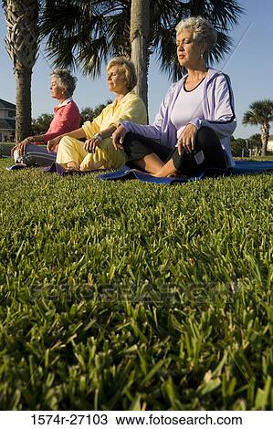 Senior women sitting on exercise mat and meditating View Large Photo Image Stock Image - Senior women sitting on exercise mat and meditating. Fotosearch