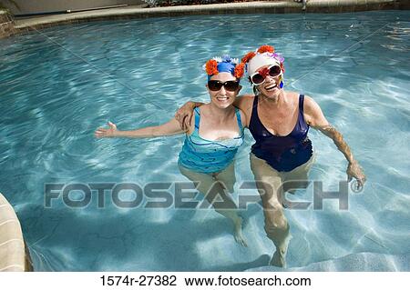 Senior women standing in swimming pool View Large Photo Image Stock Image - Senior women standing in swimming pool. Fotosearch