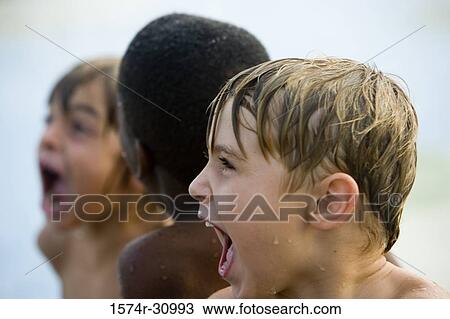 Side view of a boy shouting View Large Photo Image Stock Image - Side view of a boy shouting. Fotosearch