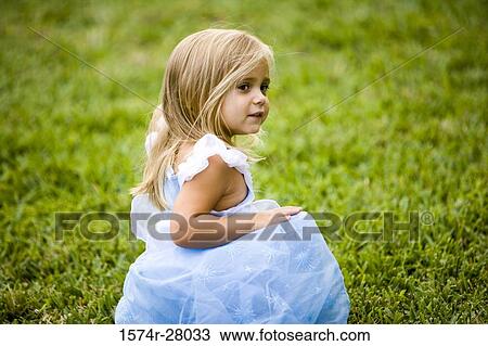 Side view of a girl looking over shoulder View Large Photo Image Stock Image - Side view of a girl looking over shoulder. Fotosearch
