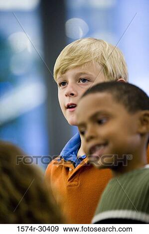 Side view of schoolboys looking away View Large Photo Image Stock Photo - Side view of schoolboys looking away. Fotosearch