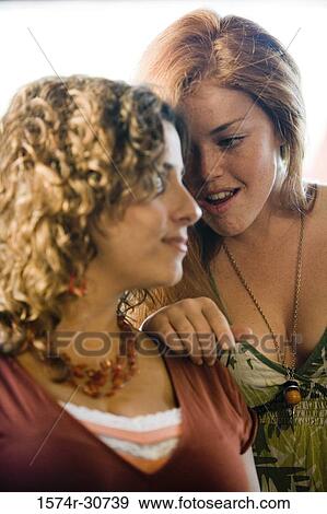 Sisters sitting together View Large Photo Image Stock Photo - Sisters sitting together. Fotosearch