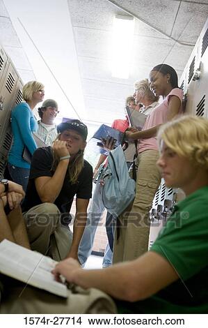 Picture - Students by lockers in corridor. Fotosearch