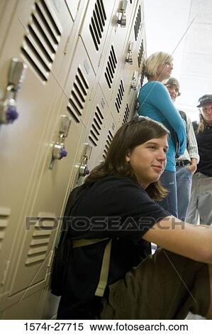 Stock Photography - Students by lockers in corridor. Fotosearch