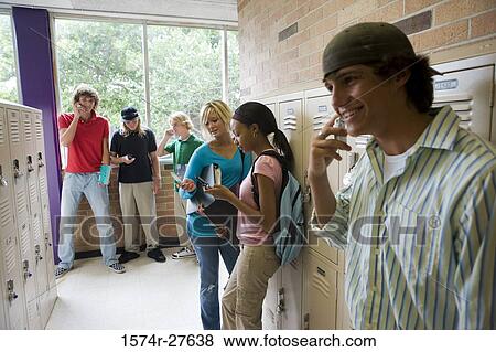 Students communicating and text messaging on mobile phone View Large Photo Image Stock Photo - Students communicating and text messaging on mobile phone. Fotosearch