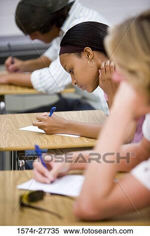 Students giving examination in the classroom View Large Photo Image Stock Photography - Students giving examination in the classroom. Fotosearch