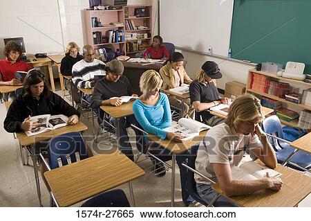 Students reading book in the classroom View Large Photo Image Stock Photography - Students reading book in the classroom. Fotosearch