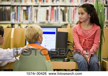 Students sitting with computer in the library View Large Photo Image Stock Photograph - Students sitting with computer in the library. Fotosearch
