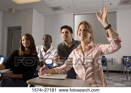 University students attending lecture while one woman hand raised in the classroom View Large Photo Image Stock Image - University students attending lecture while one woman hand raised in the classroom. Fotosearch