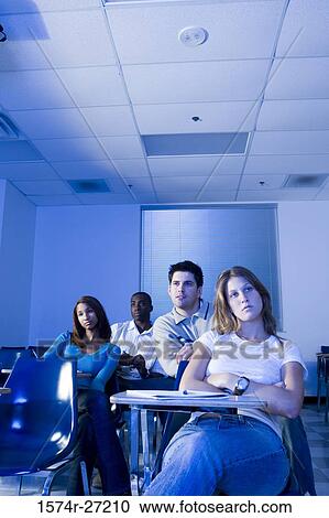 University students attending lecture in the classroom View Large Photo Image Stock Image - University students attending lecture in the classroom. Fotosearch