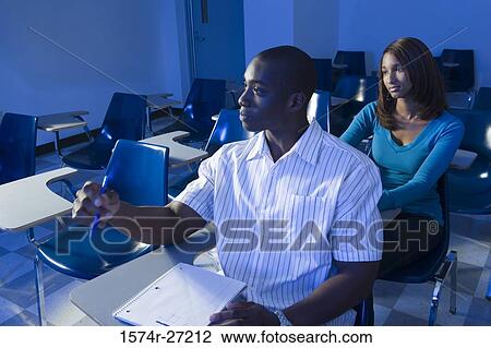 University students attending lecture in the classroom View Large Photo Image Stock Image - University students attending lecture in the classroom. Fotosearch