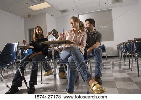 University students attending lecture in the classroom View Large Photo Image Stock Photo - University students attending lecture in the classroom. Fotosearch