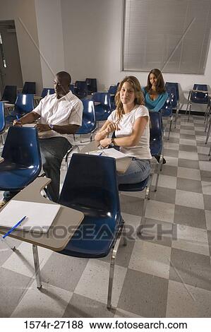 University students attending lecture in the classroom View Large Photo Image Stock Photo - University students attending lecture in the classroom. Fotosearch