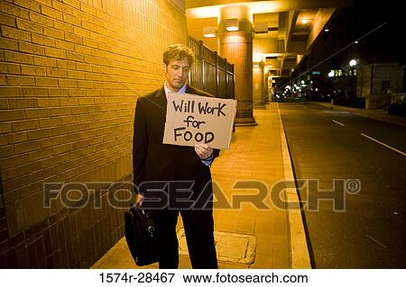 Well-dressed man holding briefcase and placard View Large Photo Image Stock Photo - Well-dressed man holding briefcase and placard. Fotosearch