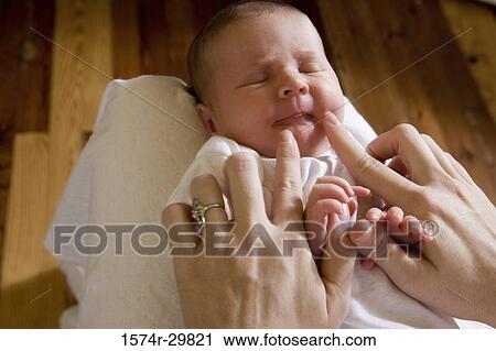 Woman playing with her baby View Large Photo Image Stock Image - Woman playing with her baby. Fotosearch