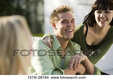 Young couple smiling View Large Photo Image Picture - Young couple smiling. Fotosearch