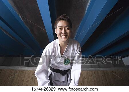 Young man smiling in sports uniform View Large Photo Image Stock Photo - Young man smiling in sports uniform. Fotosearch