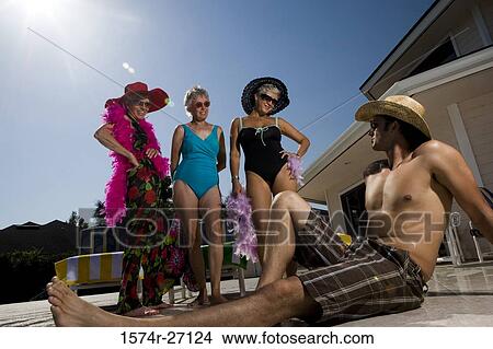 Picture - Young man watching senior women in swimsuit and fur. Fotosearch