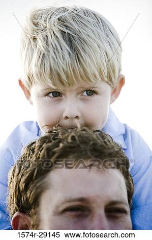 Young man with son at the beach View Large Photo Image Stock Photography - Young man with son at the beach. Fotosearch