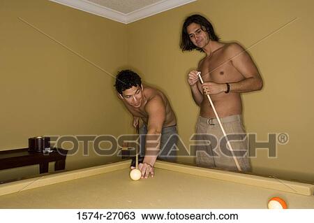 Young men playing pool with pool cue and ball on pool table View Large Photo Image Stock Image - Young men playing pool with pool cue and ball on pool table. Fotosearch