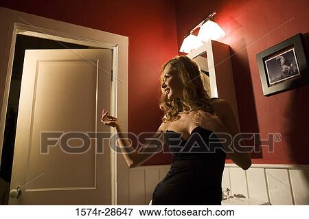 Young prostitute in a gown standing by sink View Large Photo Image Stock Photo - Young prostitute in a gown standing by sink. Fotosearch