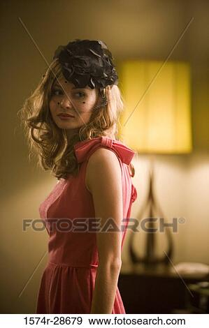 Young prostitute in a red dress standing in the bedroom View Large Photo Image Stock Photo - Young prostitute in a red dress standing in the bedroom. Fotosearch